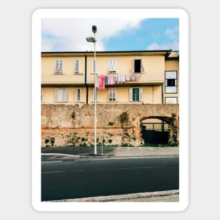 Yellow Residential Building in Italy With Drying Laundry on Washing Line Sticker